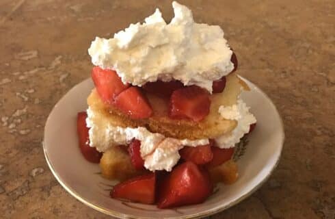Homemade strawberry biscuit breakfast with fresh whipped cream